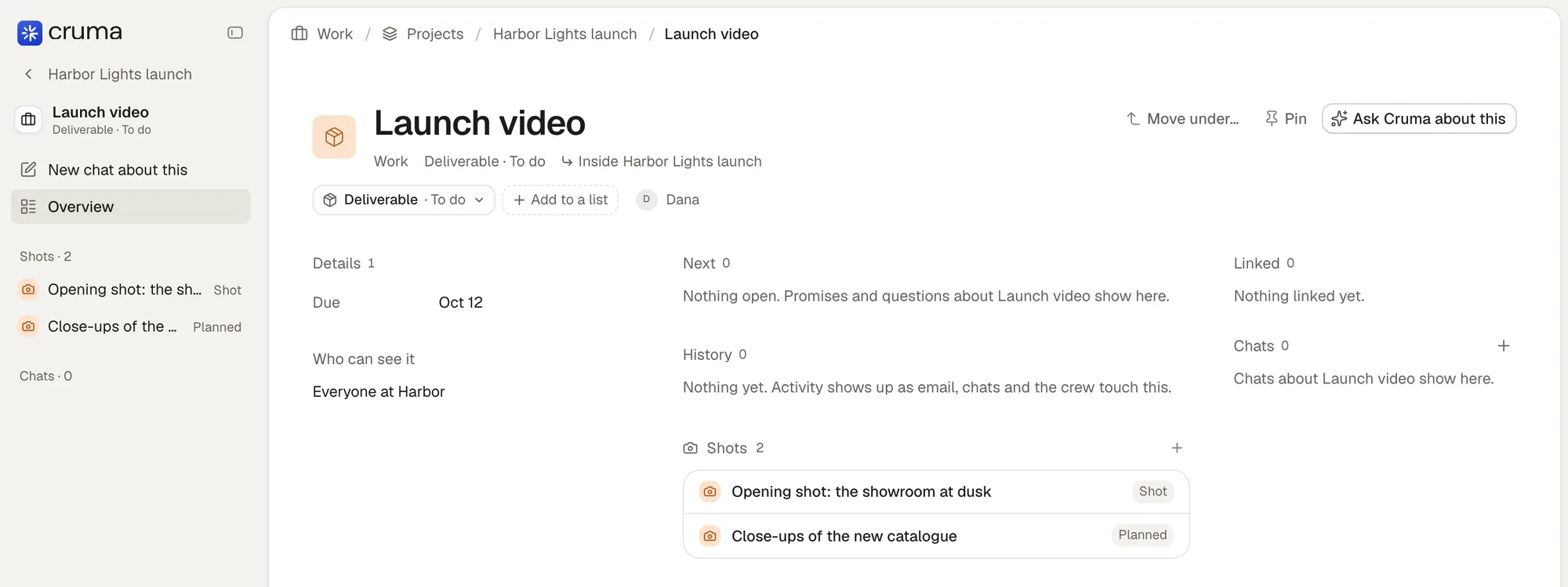 Launch video, a deliverable inside Harbor Lights launch: the sidebar with ‹ Harbor Lights launch at the top and its two shots; breadcrumbs Work / Projects / Harbor Lights launch / Launch video; the Deliverable · To do chip, Add to a list and Move under; Details with Due Oct 12, Next, History, Linked and Chats; and a Shots section with two shots